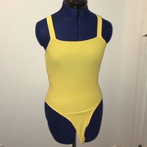 yellow bodysuit